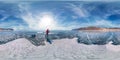 Tourist with sleds walks along the blue ice of Lake Baikal. Spherical 360 degrees 180 panorama Royalty Free Stock Photo