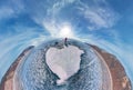 Tourist with sleds walks along the blue ice of Lake Baikal. Wide-angle panorama Royalty Free Stock Photo