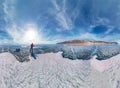 Tourist with sleds walks along the blue ice of Lake Baikal. Wide-angle panorama Royalty Free Stock Photo