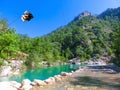 Tourist sliding on a zip line in the canyon of Harmony, near the town of Goynuk and Antalya