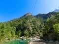 Tourist sliding on a zip line in the canyon of Harmony, near the town of Goynuk and Antalya