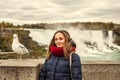 Portrait of a beautiful girl on the background of Niagara Falls with a seagull Royalty Free Stock Photo