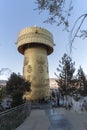 Tourist spinning the world`s biggest Prayer Wheel in Shangri-La Golden Temple