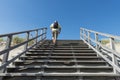 Tourist on Stairs of Beach Entrance