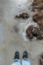 Tourist stand on frozen pond in winter in Zero Point at Lachung. North Sikkim, India