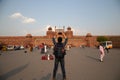 Tourist stand and take photo at Main entrance of Red Fort building