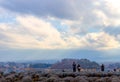 Tourist standing backwards and take a photo Fuji mountainous from lake kawaguchi side in Japan country