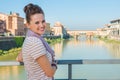 Tourist standing on the bridge overlooking Ponte Vecchio Royalty Free Stock Photo