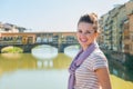 Tourist standing on the bridge overlooking Ponte Vecchio Royalty Free Stock Photo