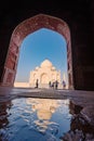 tourist standing in front entrance gate of Taj Mahal indian palace. Islam architecture. Door to the mosque