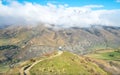 Tourist standing on the ridge of the mountain nearly Crown Range Road, the highest paved highway in Cardrona valley, Otago region Royalty Free Stock Photo