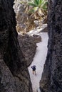 A tourist stands at the bottom of the Togo Chasm in Niue