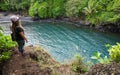 A tourist stands at Maui's Venus Pool, Waioka Pond