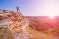 A tourist stands on top of a mountain and admires from above a view of the Ural taiga. Royalty Free Stock Photo