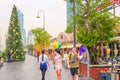 Tourist street of the entertainment complex Asiatic, decorated Christmas tree on New Year's holidays, walking tourists.