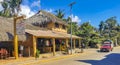 Tourist street restaurants houses people cars hotels stores Mazunte Mexico Royalty Free Stock Photo