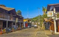 Tourist street restaurants houses people cars hotels stores Mazunte Mexico Royalty Free Stock Photo