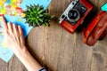 tourist stuff with camera and map on wooden background top view mockup