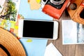 tourist stuff with camera and map on wooden background top view