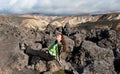 Tourist sunbathing on the lava field in Iceland