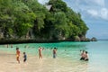 Tourist swimming at a private beach in Bali