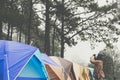 Tourist take photo near tent in mist & fog. camping in forest. p Royalty Free Stock Photo