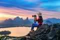 Tourist take a photo on Phu sub lek viewpoint at sunset, Lopburi, Thailand