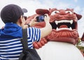 Tourist Take picture of Chinese Lion front of Wenwu temple Gate Landmark Puli Taiwan Royalty Free Stock Photo