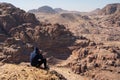 Tourist take picture and enjoy view of Roman theater in Petra ancient city, Jordan