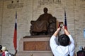 A tourist takes a photo of a monument Royalty Free Stock Photo