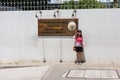 Tourist takes a photograph with Embassy sign