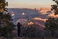 Tourist takes picture of Grand Canyon