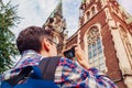 Tourist takes pictures of catholic church of St. Olha and Elizabeth in Lviv, Ukraine.