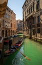 Tourist taking gondola ride in Venice city