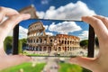 Tourist taking photo of the Ancient Roman Colosseum, Rome, Italy Royalty Free Stock Photo