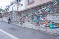 Tourist are taking photo with the art work decoration in the street of Gamcheon Culture Village, Busan Royalty Free Stock Photo