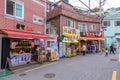 Tourist are taking photo with the art work decoration in the street of Gamcheon Culture Village, Busan Royalty Free Stock Photo