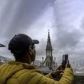 tourist taking a photo in the basilica of the national vote