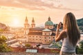 Tourist taking a photo of beatiful sunset in Salzburg Austria Royalty Free Stock Photo