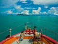 Tourist taking photo on bow of ferry heading to Samui, Thailand