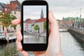 Tourist taking photo of Copenhagen cityscape