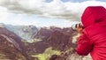 Tourist taking photo from Dalsnibba viewpoint Norway Royalty Free Stock Photo