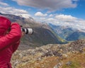 Tourist taking photo from Dalsnibba viewpoint Norway Royalty Free Stock Photo