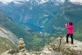 Tourist taking photo from Dalsnibba viewpoint Norway Royalty Free Stock Photo