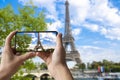 Tourist taking photo of Eiffel tower in Paris, France Royalty Free Stock Photo