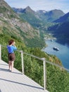 Tourist taking photo of fjord landscape, Norway Royalty Free Stock Photo