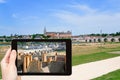 Tourist taking photo of Gien town, France