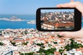 Tourist taking photo of Marseille city skyline
