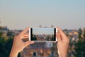 Tourist makes a photo of view on Vittoriano monument in Rome