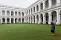 Tourist is taking a photo of Victorian architectural style with center courtyard inside Indian Museum.